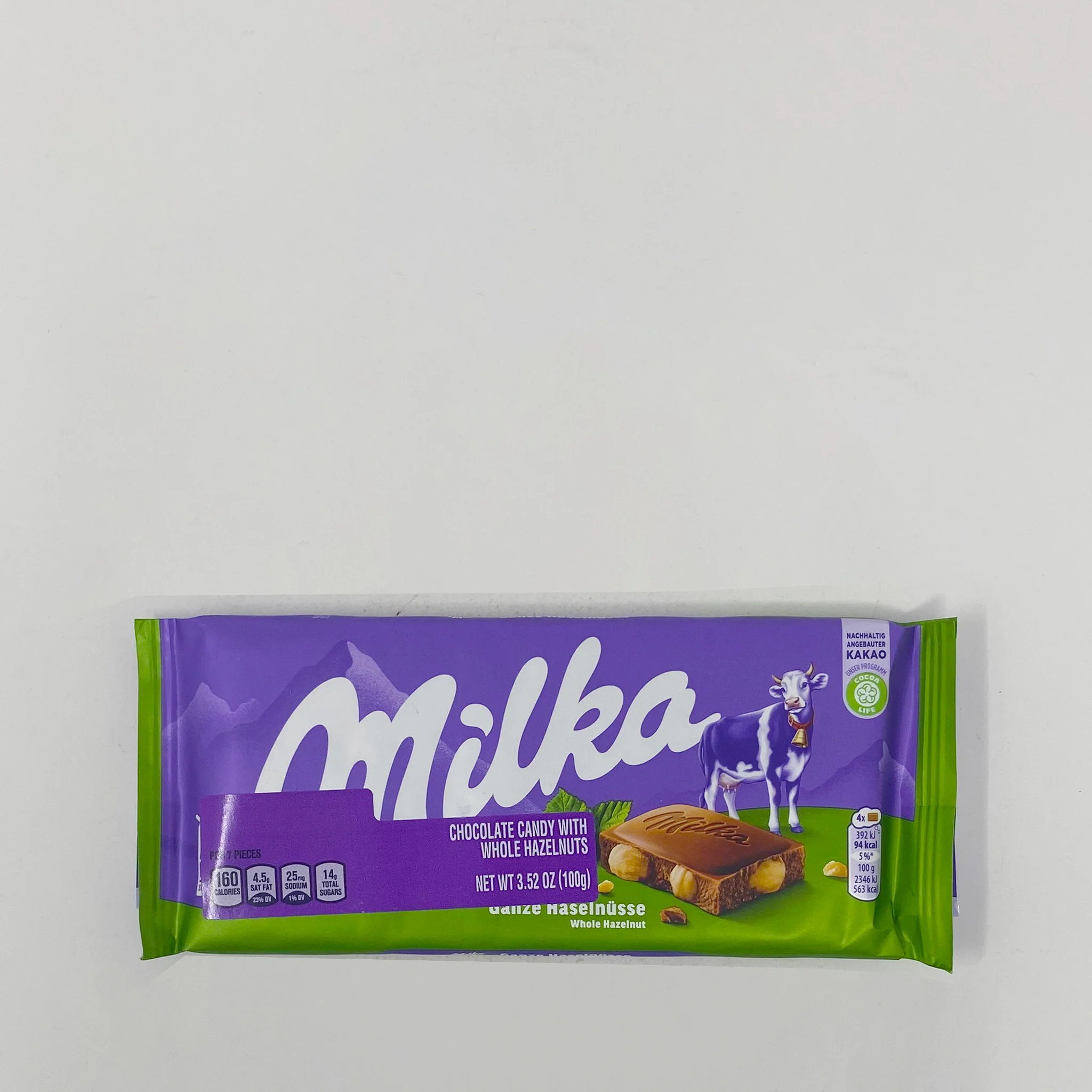 Milka chocolate and whole hazelnut 100g